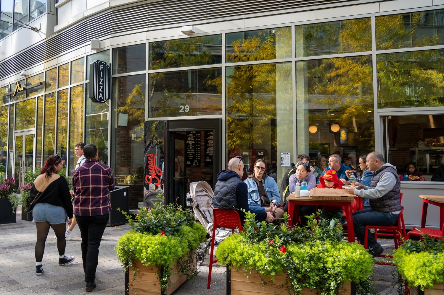 Located in the Seaport district of Boston, Sugar’s Hot Pizza & Subs takes full advantage of its picturesque surroundings, boasting an outdoor patio complete with string lights overhead.