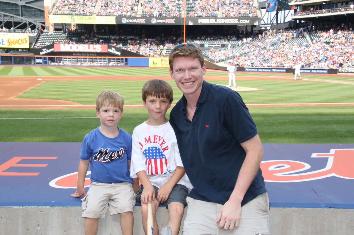 Writer Wyatt J. Meyer (middle) with his brother Cash (left) and father Tim (right) at a Mets game on July 7, 2012. Dillon Gee pitched 8 innings in a 3-1 Mets win.
