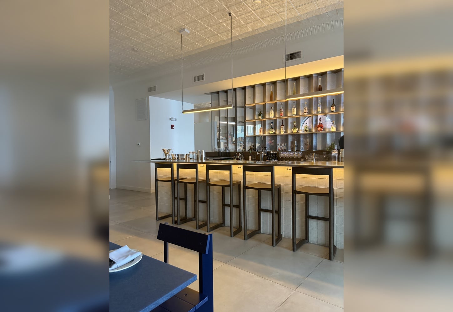 The relative simplicity of the restaurant is mitigated by the bar and open-view kitchen, which provide a warm, bustling feel.