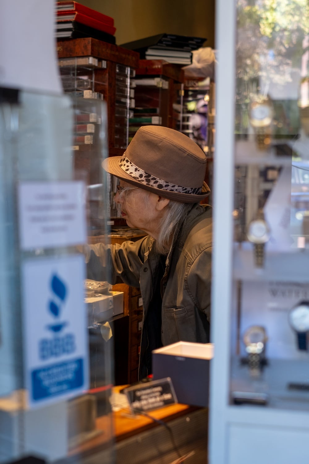 Susan Lelyveld, the owner of the Swiss Watchmaker, is known for her signature feathered fedora.