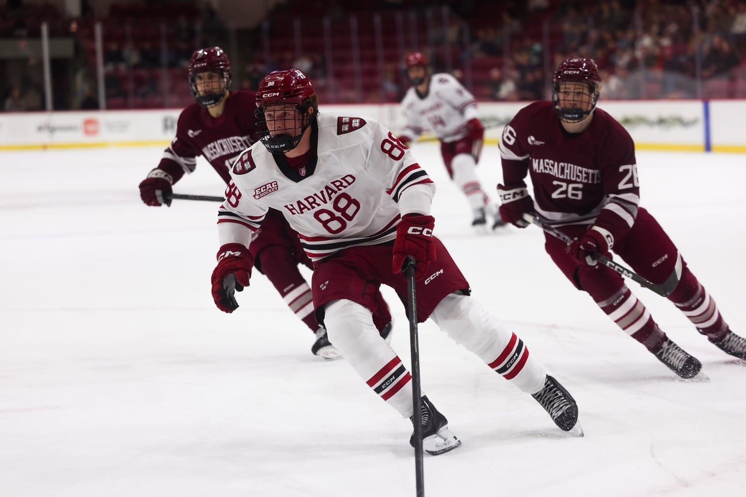 Sophomore forward Aidan Lane chases a puck into the zone. 